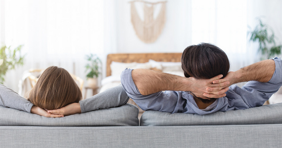 Couple relaxing on their couch